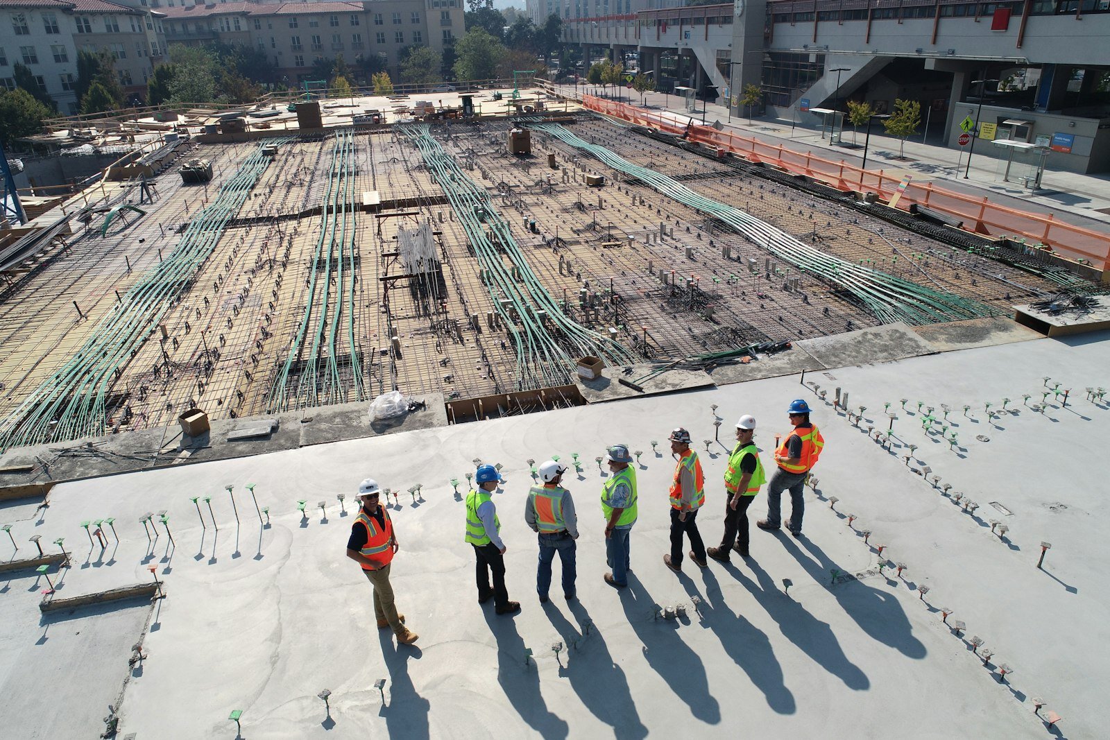 Aerial view of a large-scale construction site with cranes and infrastructure development