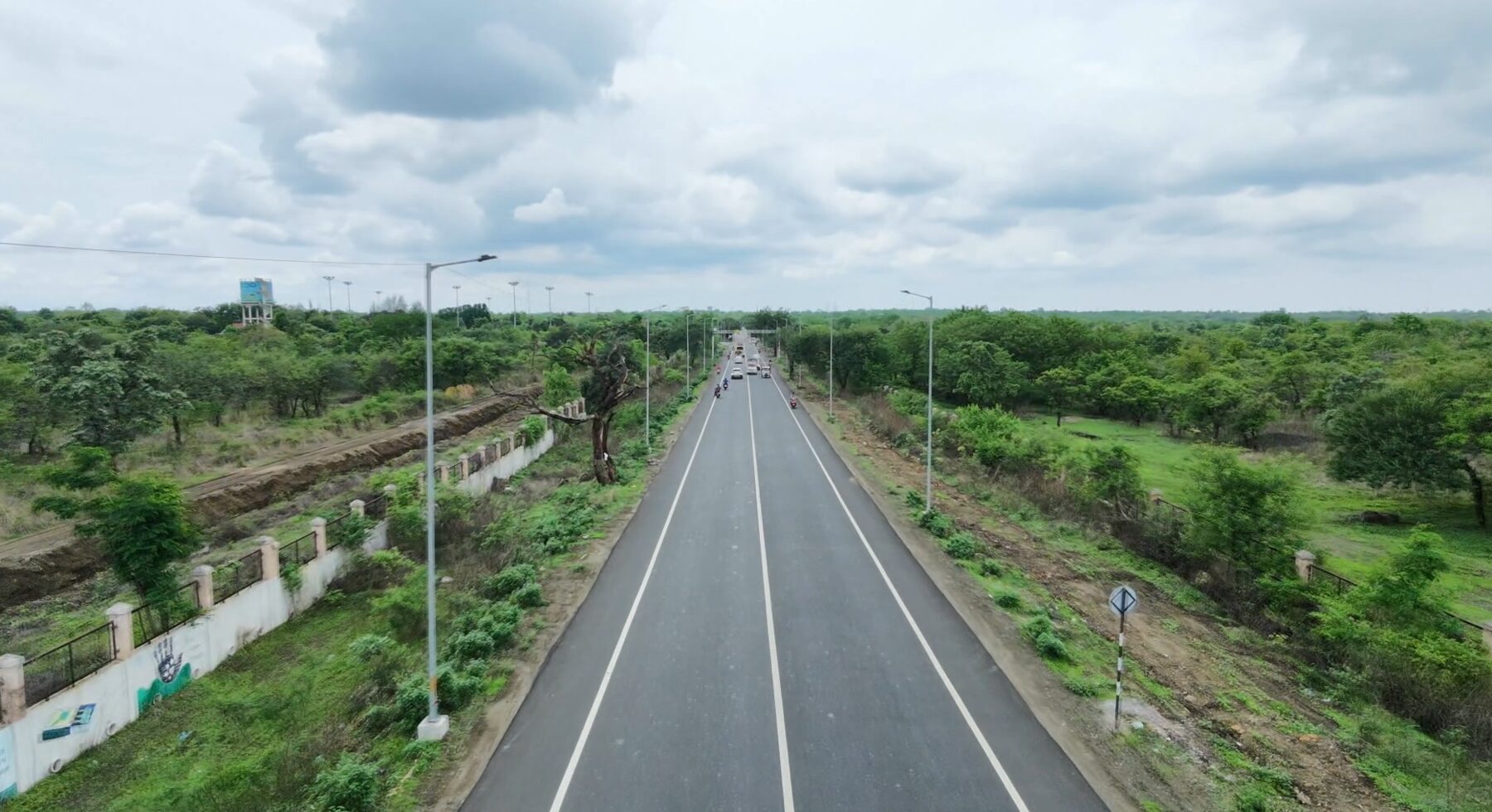 Aerial view of freshly paved NH-353J Nagpur-Katol highway section with improved shoulders and road markings