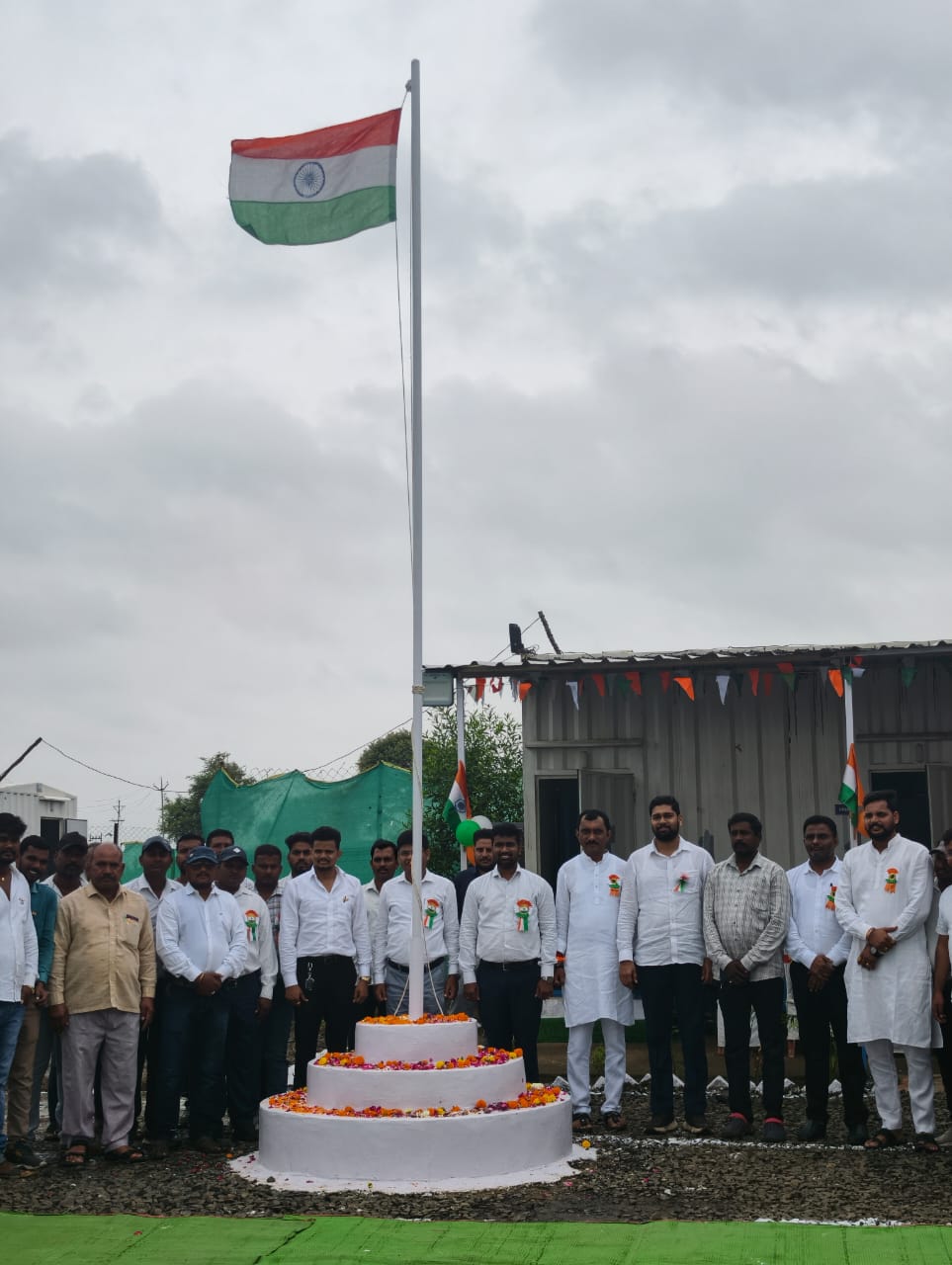 Sunrise leadership, engineers, and workforce celebrating national flag hoisting ceremony at project site